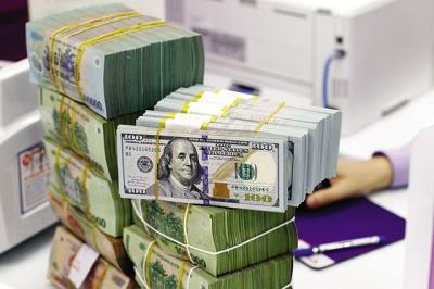 TPS: Tỷ giá có thể đạt 26,000 VND/USD vào cuối năm, lãi suất duy trì mức thấp